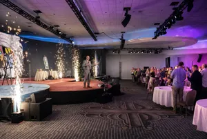 Corporate gala speaker presenting on stage