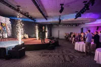 Speaker presenting on stage at corporate event