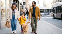 Family walk on a city sidewalk