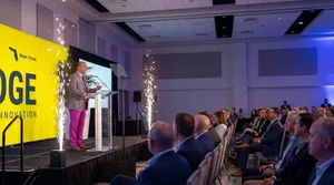 Speaker at tech conference with sparks