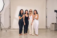 Group portrait of four smiling women