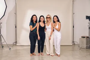 Group portrait of four smiling women