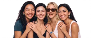 Group of four women laughing together (cutout)