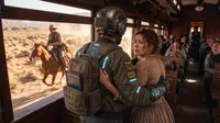 Time traveler protecting woman on train