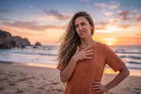 Disgusted woman posing on sunset beach