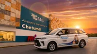 [Image 1] the taxi in front of the chetumal…