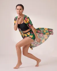 Woman in floral swimwear posing playfully