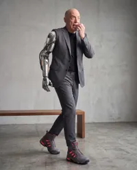 Anxious man with robotic arm walking