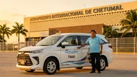 [Image 1] [Image 2] taxi driver standing next to…