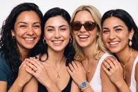 Four diverse smiling friends portrait