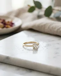 Elegant gold diamond ring on marble