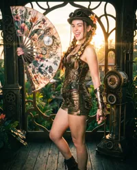 Steampunk explorer posing with floral fan