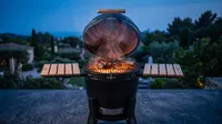 KURO GRILL charcoal steak grilling at dusk