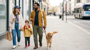 Happy family walking dog downtown