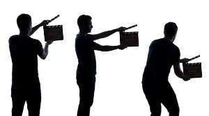 Three silhouettes holding clapperboards (cutout)