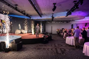 Speaker at corporate event with pyrotechnics