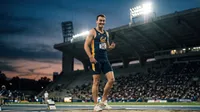 Athlete celebrates post-competition at twilight stadium